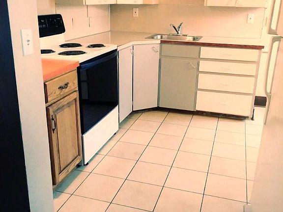 The kitchen will be on your immediate right when you enter the apartment. Past the refigerator on the right of this photo is the little breakfast nook area which you can't see in this photo.