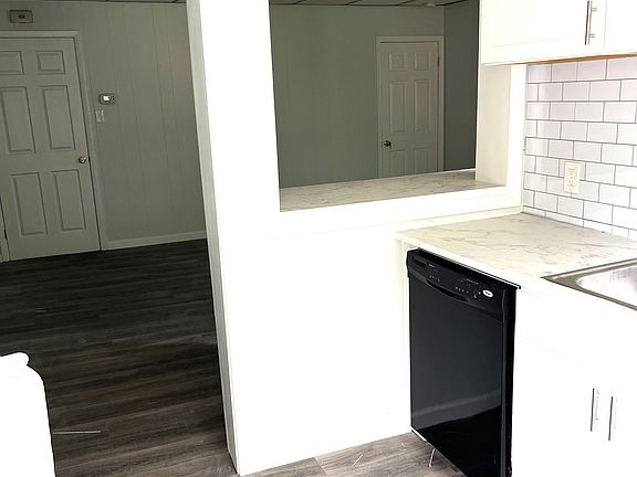 Kitchen, breakfast bar, and living room