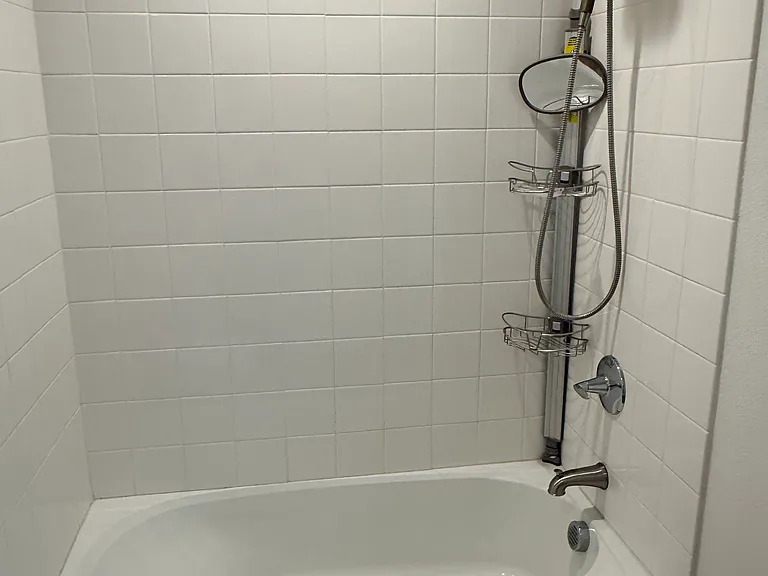 Bathtub in shared bathroom in top floor