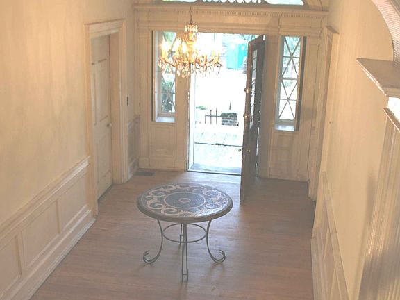 Front hallway again with hand reeded arch in top foreground