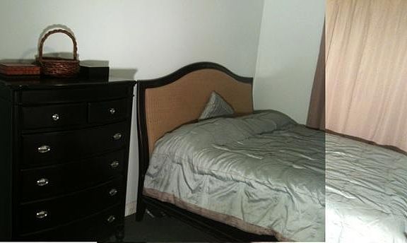 Large bedroom with TV, walk in closet