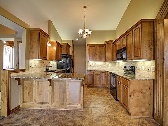 Granite and beautiful cabinets
