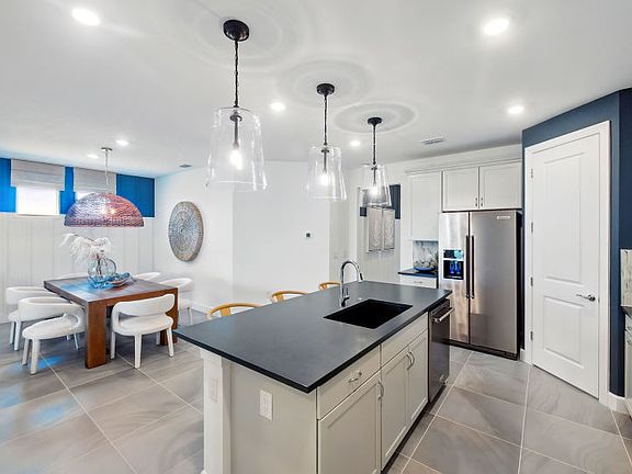 Island overlooking the gathering room of this new home