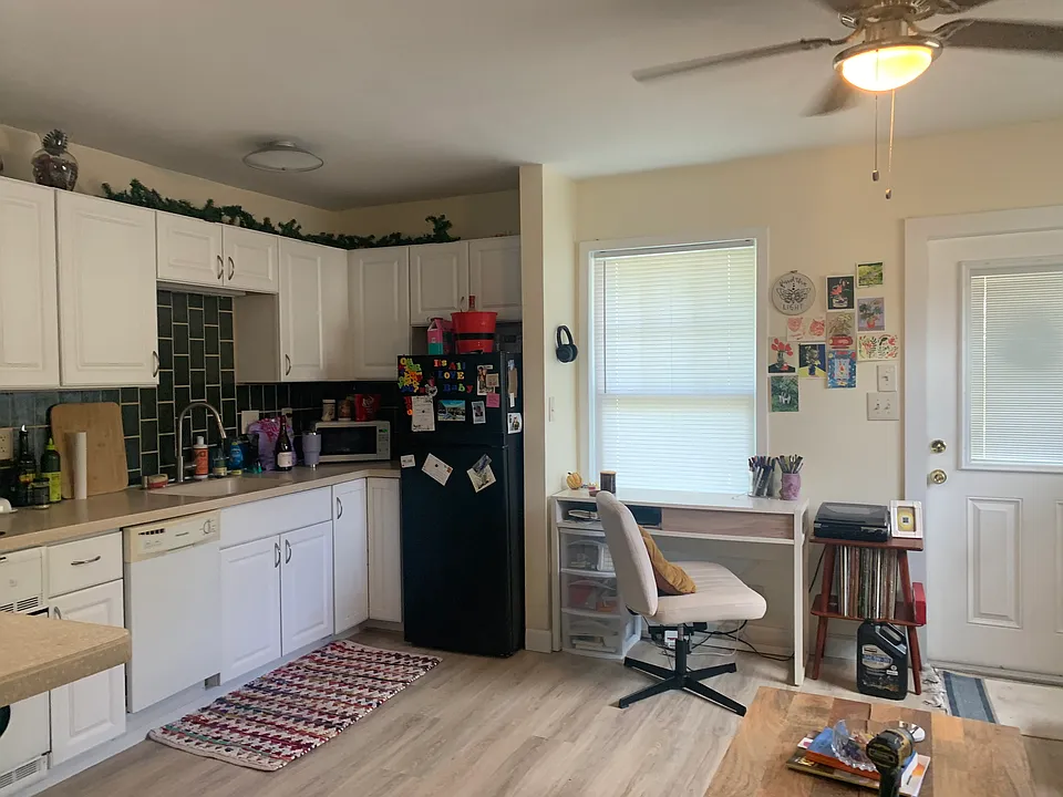 View from bedroom into kitchen/living room area