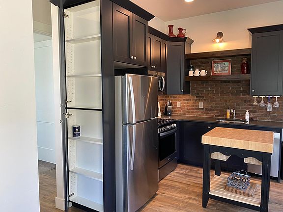 Clever storage cabinet at side of refrigerator