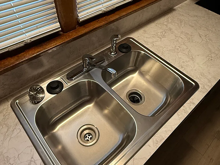 A new stainless steel double kitchen sink.