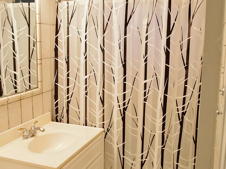 Bathroom With Tub/Shower. Classic Ceramic Tilework.