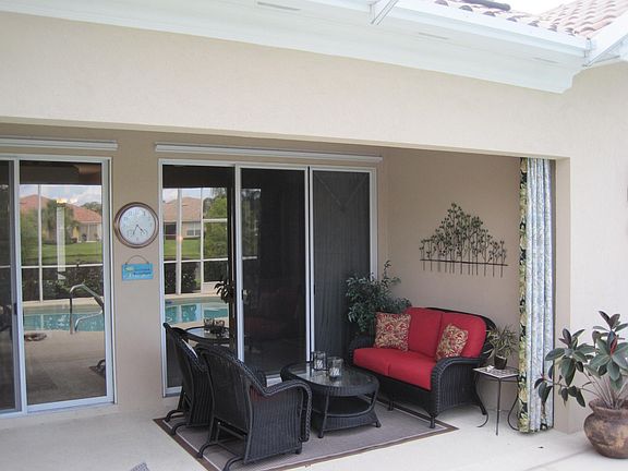 covered lanai with triple sliding doors
