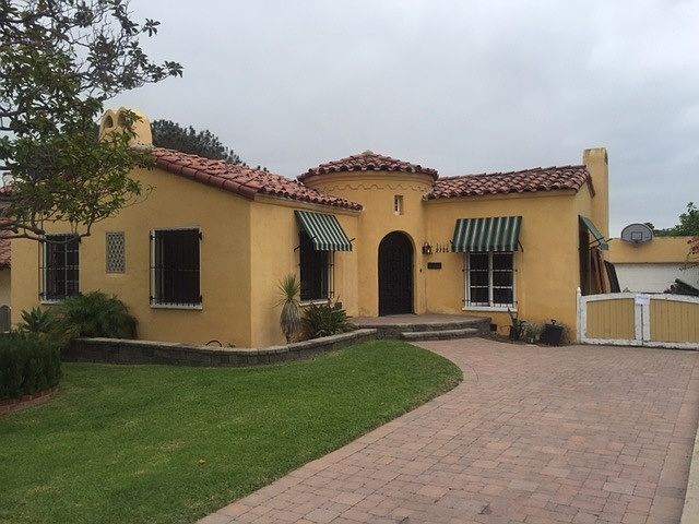 Historic Spanish with long driveway and garage