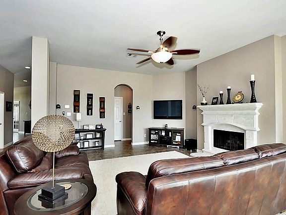 The living room has tile flooring  and overlooks the backyard. It also has a great flow from the kitchen and dining room which makes entertaining easy.