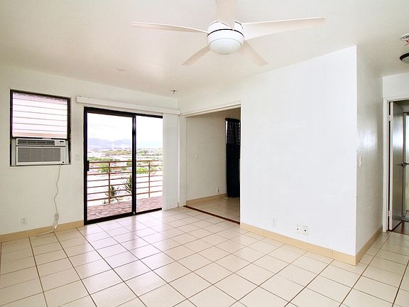 Living room, the master bedroom is on the right (you see the door) and the second bedroom is on the left (you can see the black curtain), there's wooden sliding doors for the second bedroom