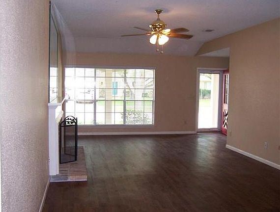   Spacious family room with beautiful flooring and warm, neutral colors!