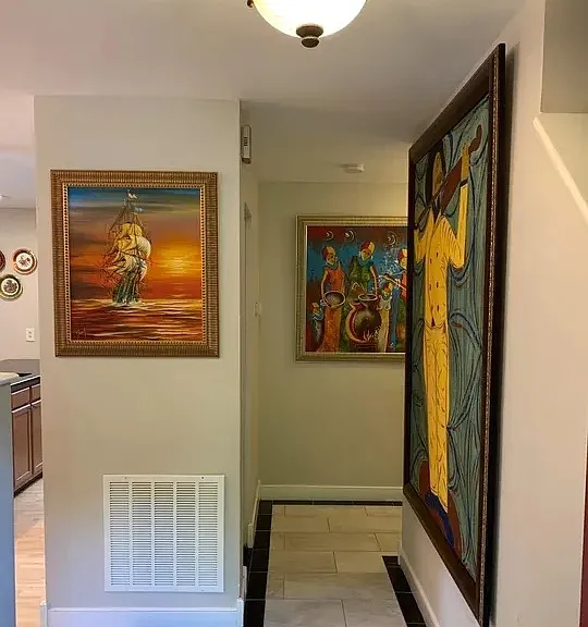 Entry hallway, living room/kitchen on the left. Bedrooms to the right. Stairs to 2nd floor