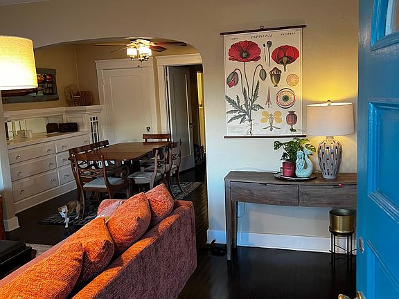 Entry. Note architectural detail of arched opening into dining area.