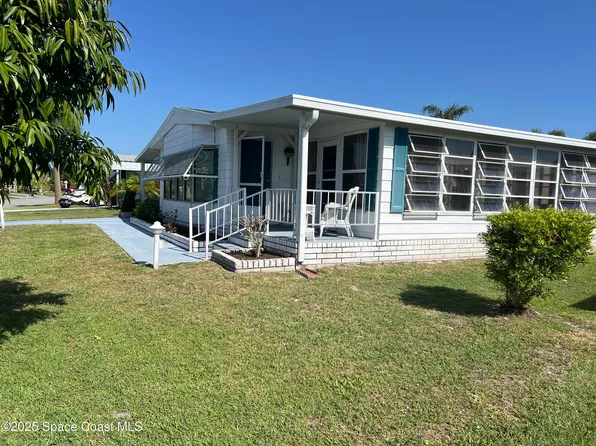 916 Dogwood Dr, Barefoot Bay, FL 32976