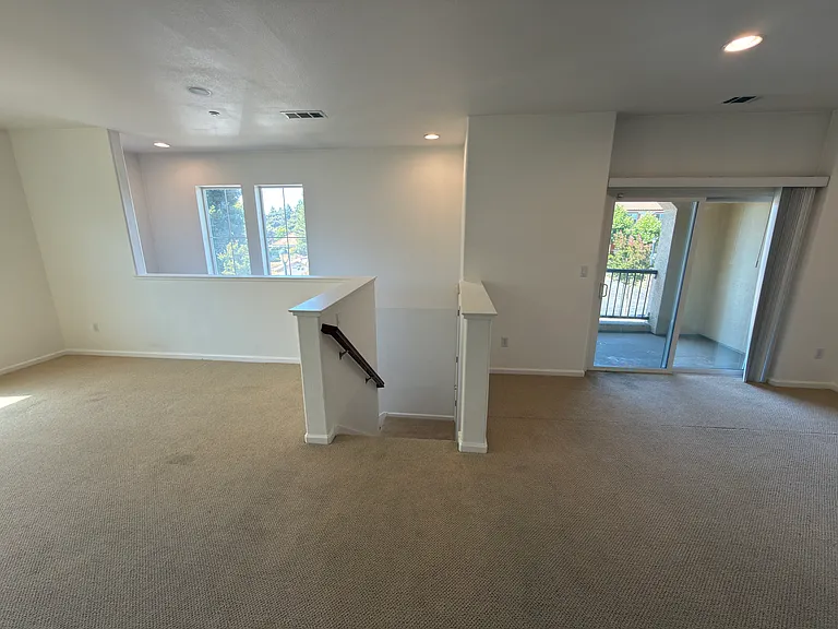 Living Area + Stairs To Garage + Dining Area + Balcony