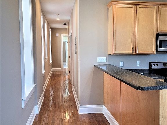 Hardwood floors throughout main hallway