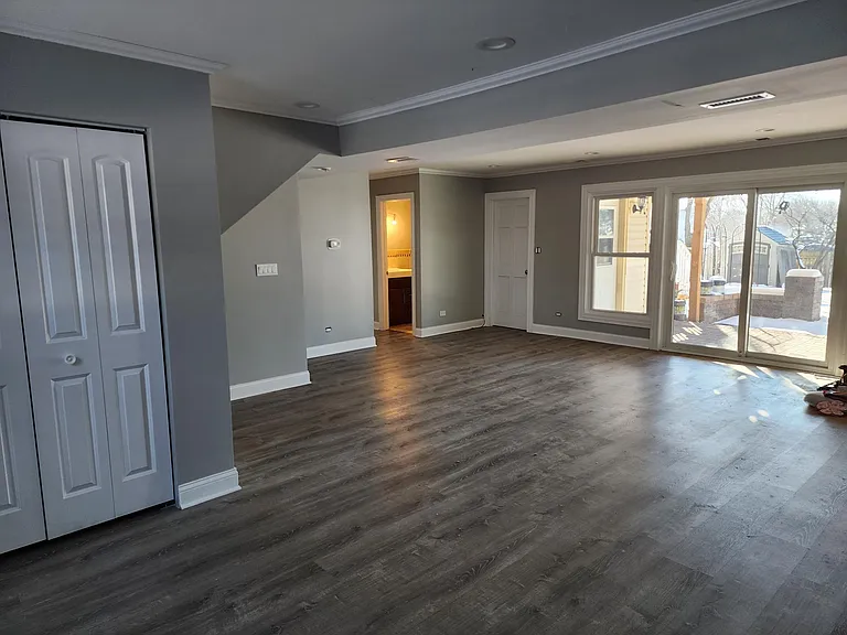 First Floor: Living room with view from other side, large closet and walk out to the rear patio.