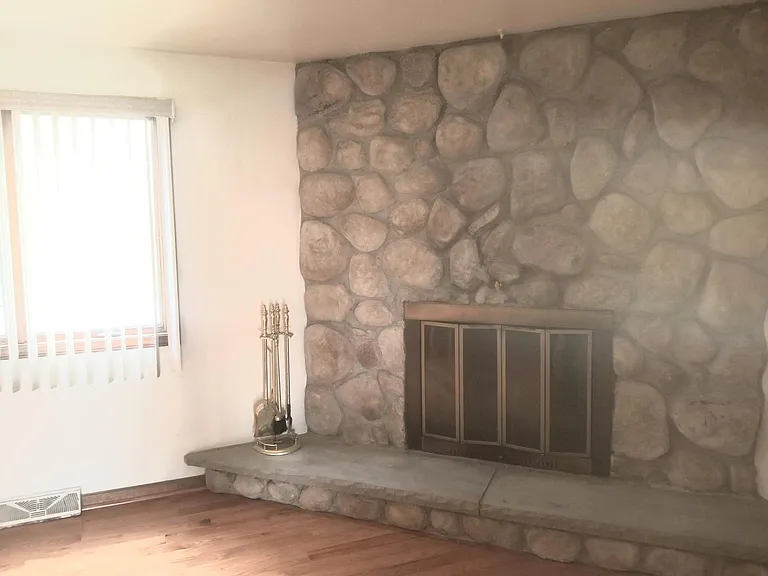 Stone fireplace is decorative, not wood burning.