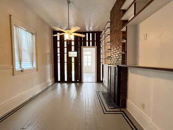 Dining room area perfect for large spacious dining table and chairs, or convert to a living room area with sofas with media center.