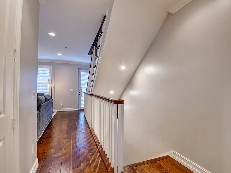 View from Kitchen looking toward living room and down steps to first floor