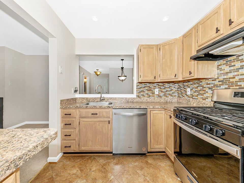 Kitchen w/ extra cabinet and counter workspace.