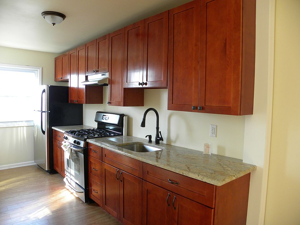 Kitchen with stainless steel appliances and granite counter