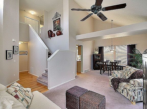 Beautiful wood floor in entry & soaring vaulted ceilings.