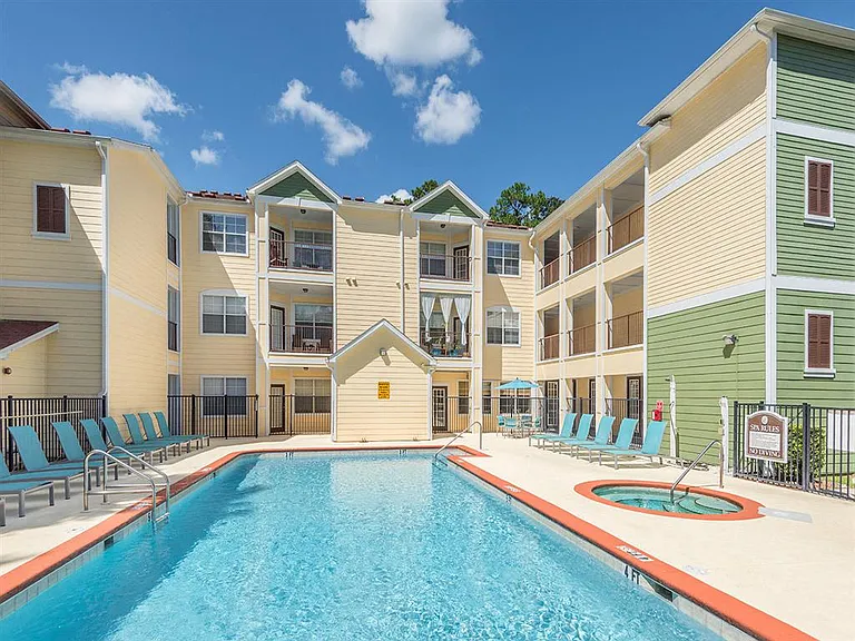 Resort-style swimming pool with spa