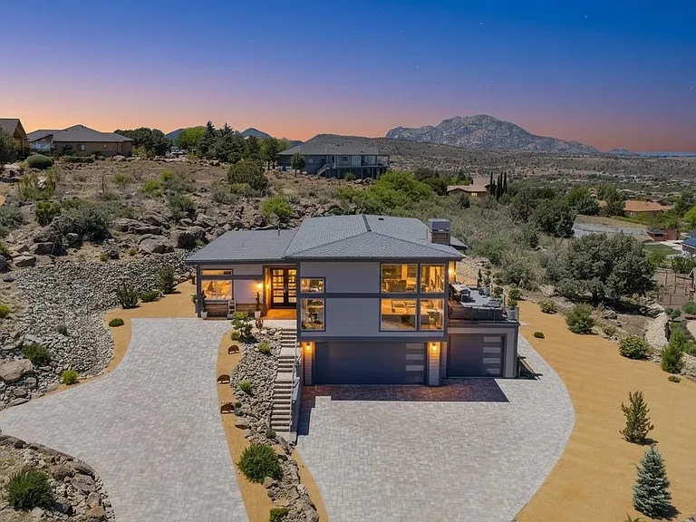 Drone view of home and land! 1.2 acres of serenity with phenomenal views. Granite Mountain in background for this view. 2 driveways make it easier for guests and renter to walk straight into home. Lower driveway into garage has stairs to home level...