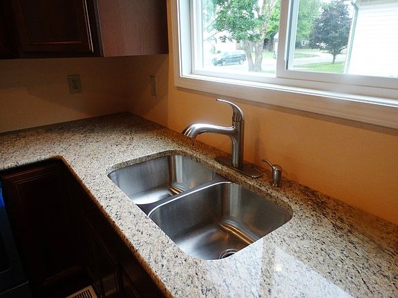 Granite countertops with a deep stainless steel under mount sink!
