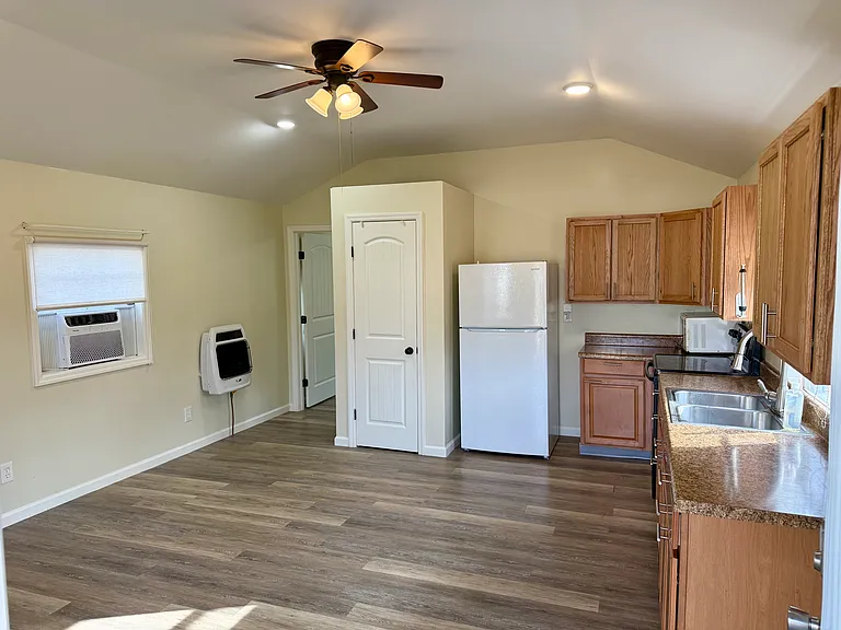 View from entry. Window air conditioner and propane wall heater
