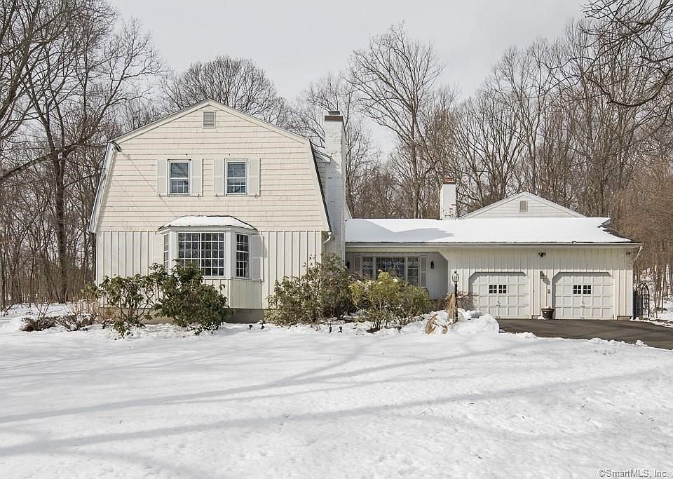 Centrally located Woodbridge colonial on cul-de-sac.