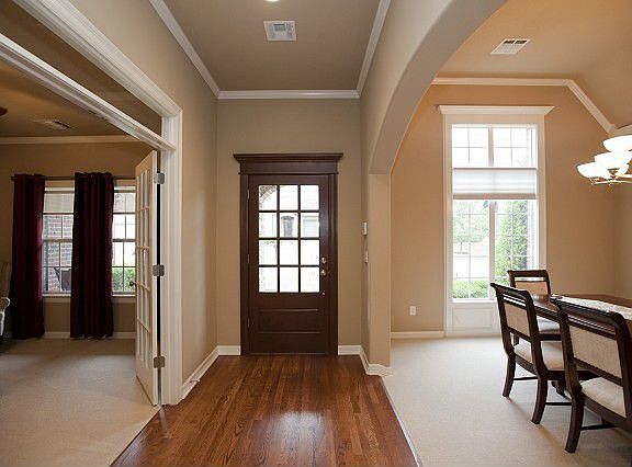 Entry with dining and sitting area access