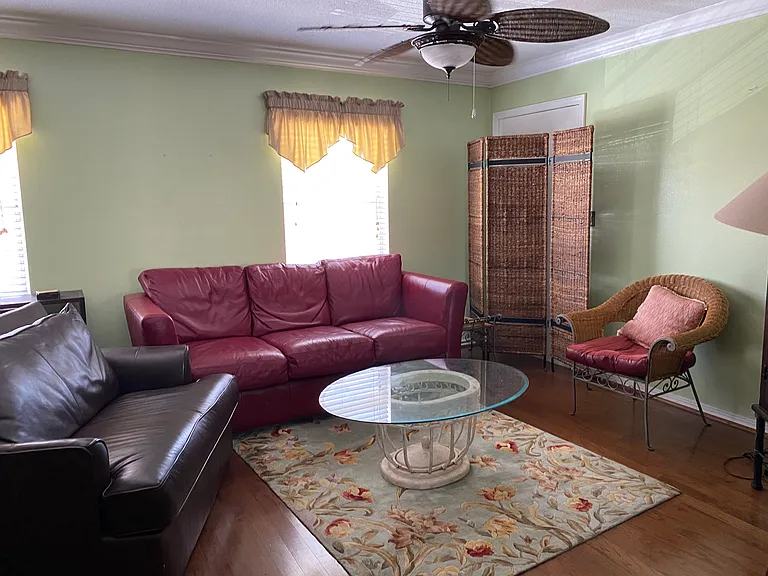 Spacious Living Area with Entrance behind this wicker screen. Separate Entrance in Kitchen.