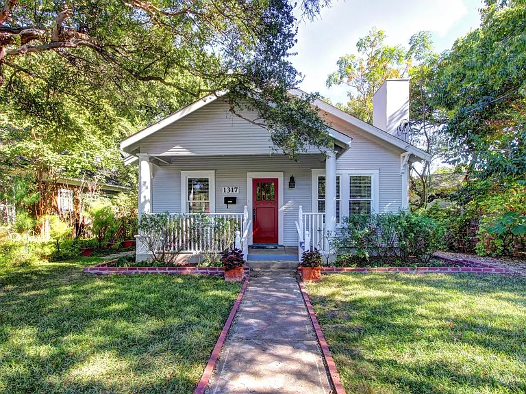 Clever addition of extra bedrooms & bathrooms does not detract from the vintage charm.