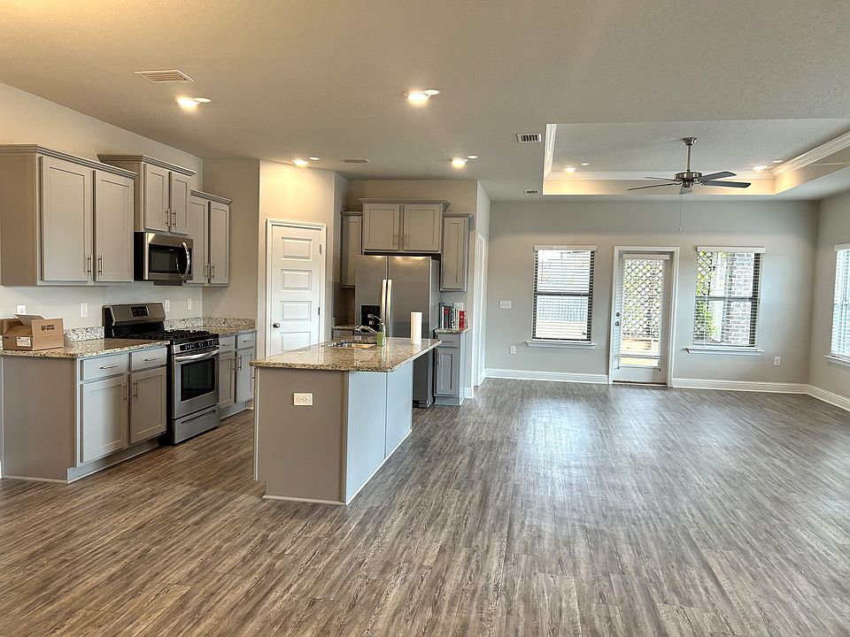 Open concept kitchen/living/dining. Vinyl plank flooring throughout. 
9-foot trayed ceilings. All stainless appliances included. Kitchen island offers additional seating.