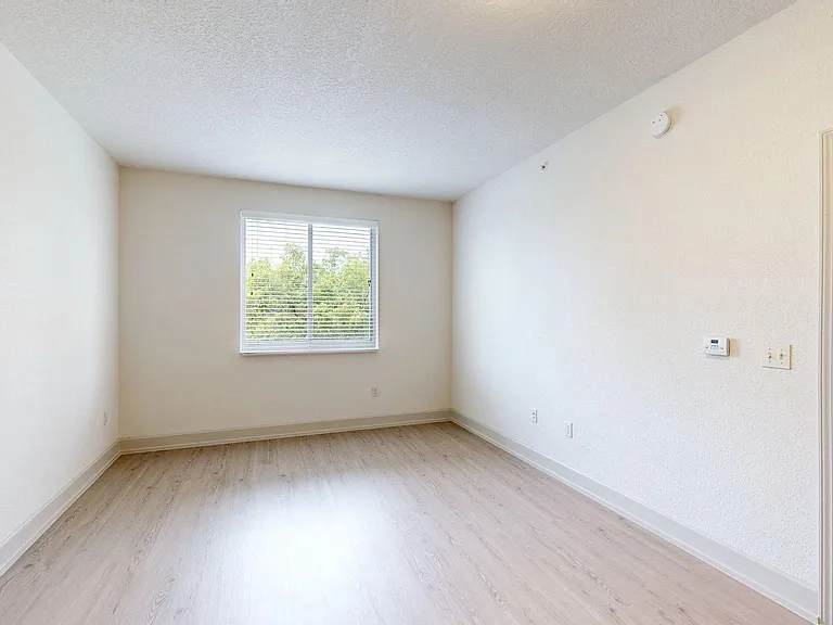 Apartment living room with wood style floor.