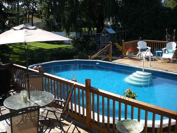 Above ground pool with large wrap-around Deck 