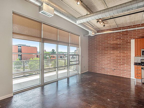 Wall of windows in combination living room/dining/kitc