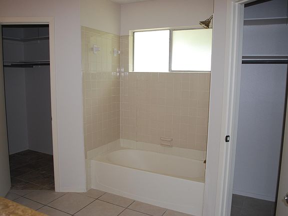 Master bath with 2 walk in closets
