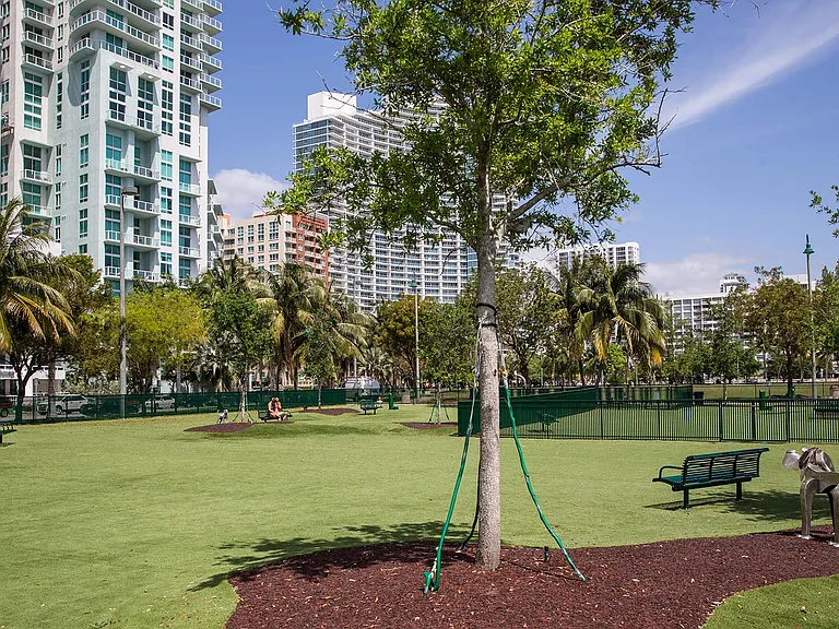A nice treat for you and your furry friend is a large, fenced in dog park located just steps away across the street