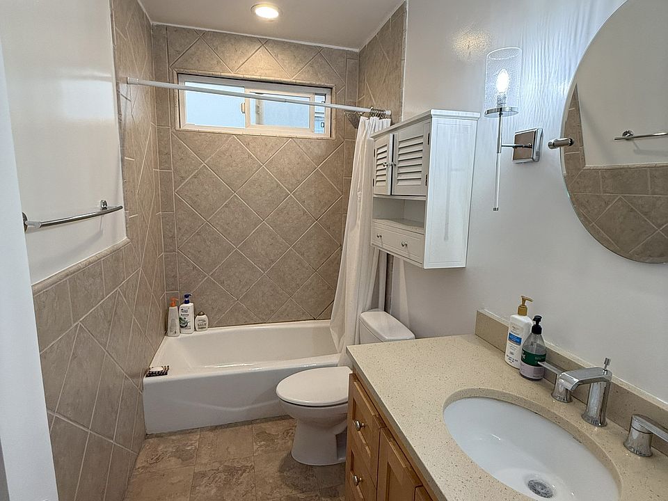 BATHROOM - NEW LARGE CABINET W/ NEW DESIGNER MIRROR & DESIGNER LIGHTING FIXTURES