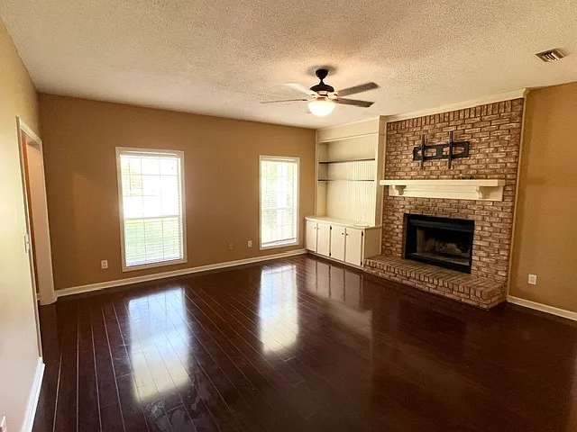 Living room with wood burning fireplace
