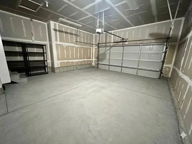 Garage holds 2 cars, SUVs, or small trucks.