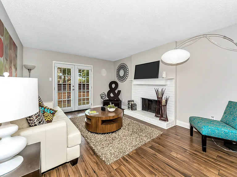 Open-concept living area with abundant natural light and flexible furniture layout options.