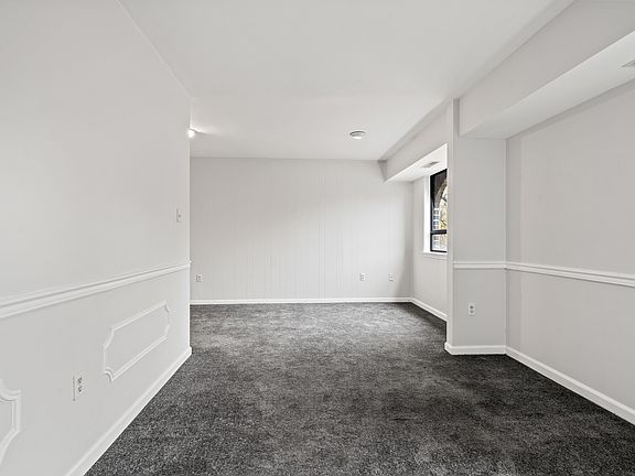 Formal Dining/Sitting Area looking into breakfast/dining area.