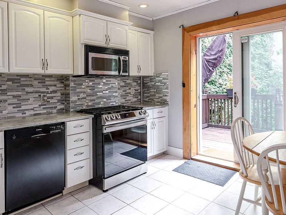 Gorgeous kitchen with excusive backyard access, deck and patio!