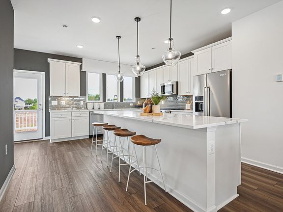 Kitchen with an Oversized Island and Stainless Steel Appliances