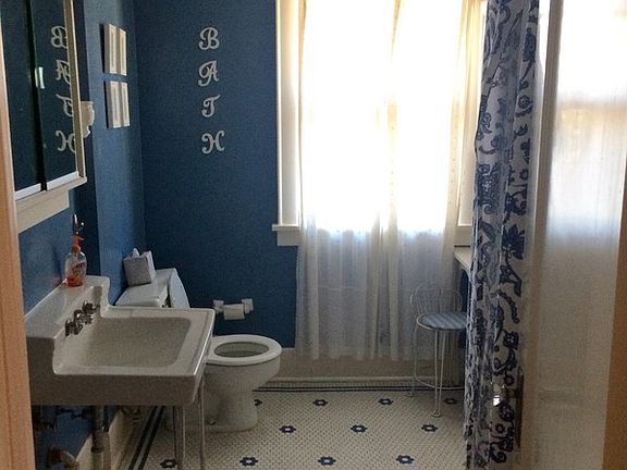 Main Bathroom
						:
						Spacious main floor bathroom with original, well-maintained honeycomb tile